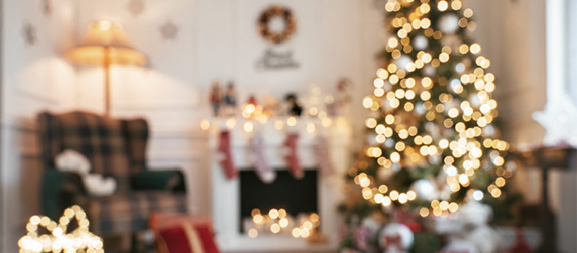 a family room glowing with christmas lights